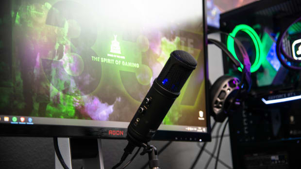 A streaming setup with computer and microphone.