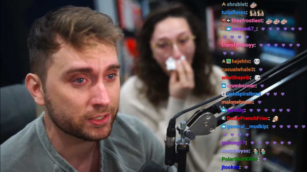 Two people in tears in front of a camera.