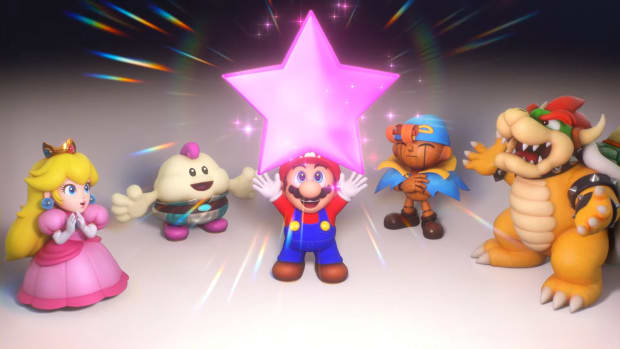 A screenshot from Super Mario RPG remake showing Mario holding up a star while various party members from the game look at it