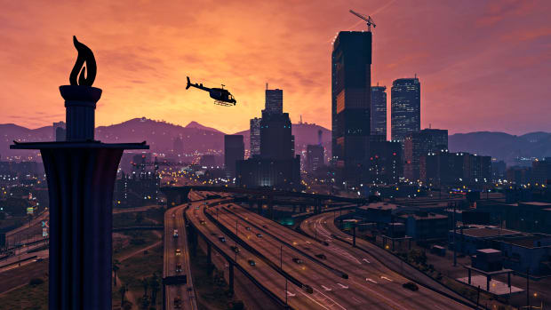 GTA 5 screenshot of downtown Los Santos at dusk as a helicopter flies overhead