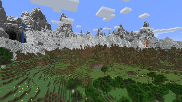 Minecraft mountain range with a forest at the foot