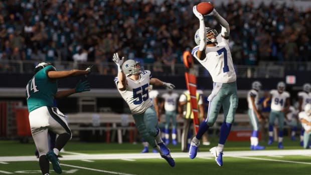 Three players jostle for the ball in Madden 23.