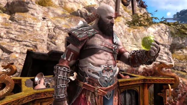 Kratos stares at an Idunn Apple from a Nornir Chest in God of War Ragnarok.