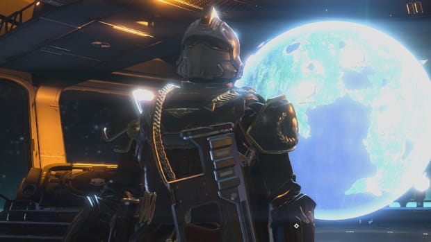 A Helldivers 2 character in a white-gold helmet, standing in front of a shining hologram of a planet