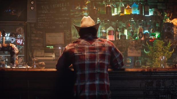 Logan aka Wolverine drinking in a bar, in a still image from the teaser trailer for Marvel's Wolverine video game.