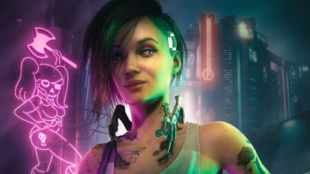 A woman with green and pink  hair in a jaw-length bob is standing near a pink neon sign in the middle of a dark city