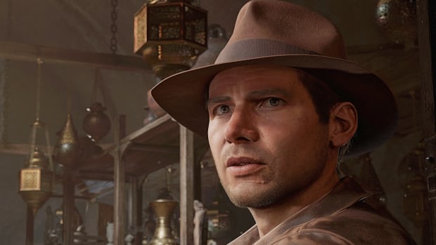 An animated Indiana Jones, based on Harrison Ford from the 1980s, is shown standing in a room full of antiques