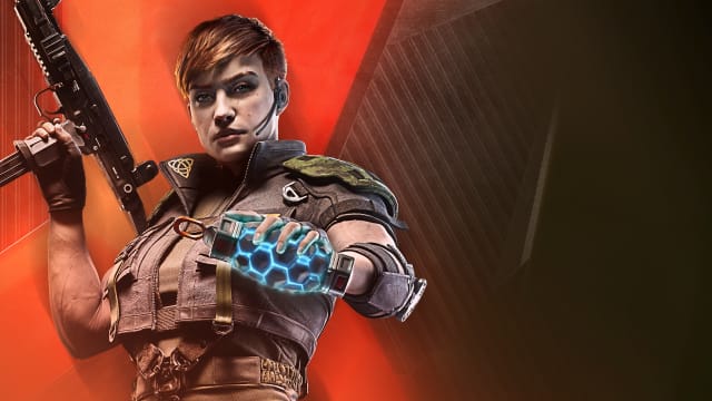 Rainbow Six Siege player accidentally told police he killed two people: An animated woman with short brown hair, wearing a thin headset and a beige combat vest, is holding a large assault rifle. She's standing against an orange and black background