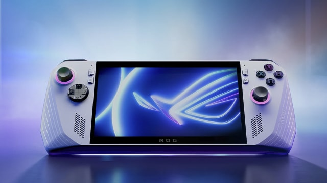 An Asus ROG Ally - a white, rectangular handheld device with face buttons and a direction pad - is pictured against a multicolored background
