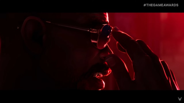Blade putting on his sunglasses.
