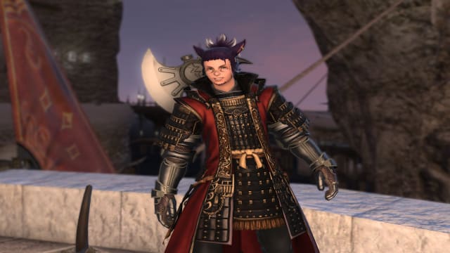A man with cat ears and purple hair in a ponytail, wearing heavy black and red studded armor, is standing on a stone balcony. A large axe is poking out above his back, and he wears a broad smile on his face.