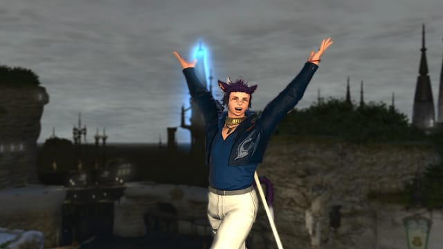A Final Fantasy 14 Miqo'te wearing a blue jacket, blue shirt, and cream-colored pants, is raising his hands with joy. Behind him is a harbor town, with a large, shining blue crystal in the background.