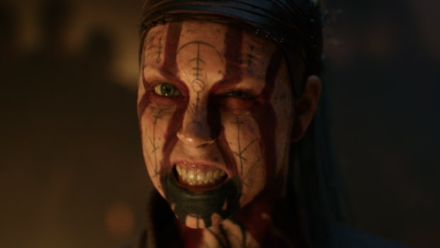 Image showing a woman with face paint fletching her teeth.