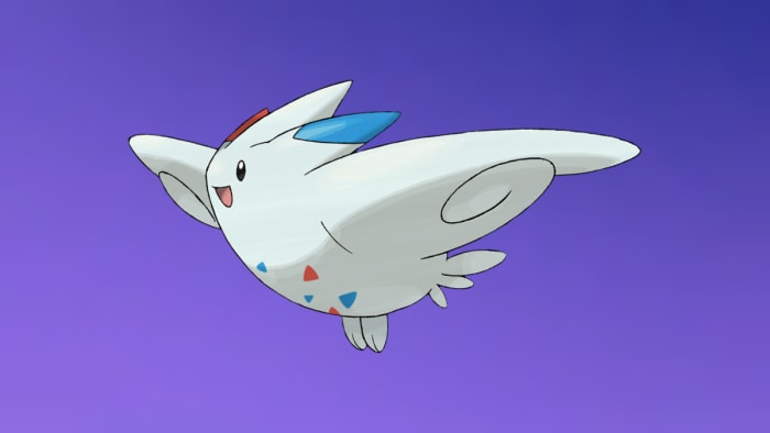 Pokémon Togekiss on Fairy-type background.