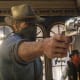 Two cowboys hold up a bank, faces obscured by balaclavas, in Red Dead Redemption 2.