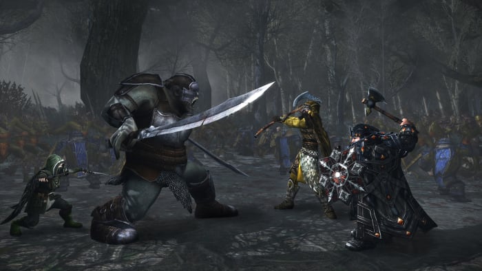Some characters fight a big orc.