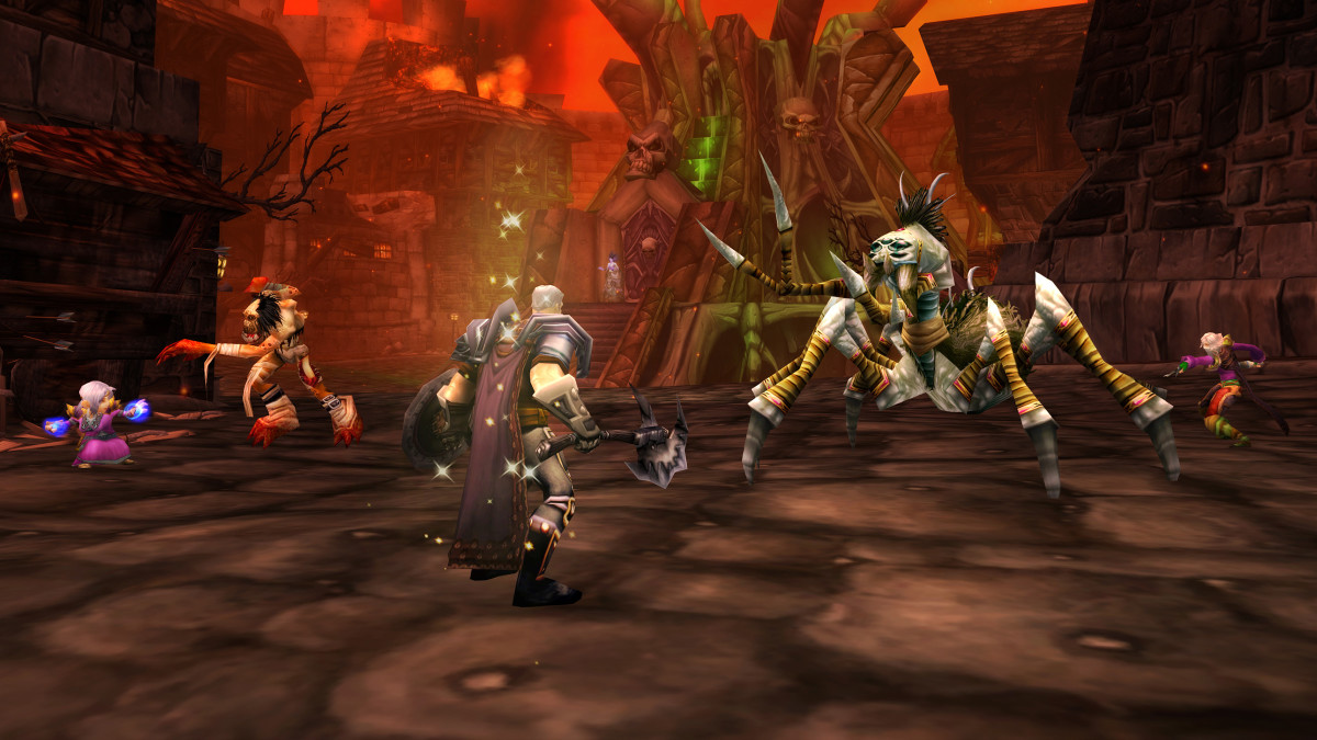 A World of Warcraft player faces off against a spider-like creature in a fiery location.