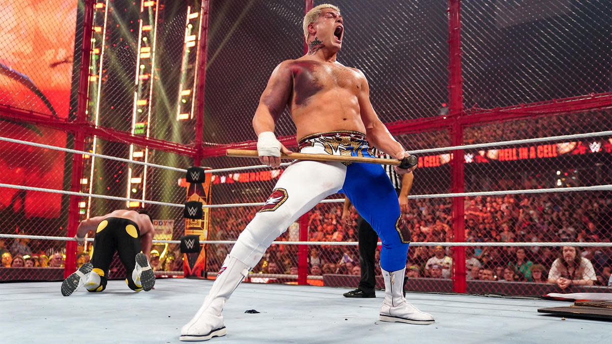 WWE wrestler Cody Rhodes holding a sledgehammer in the ring