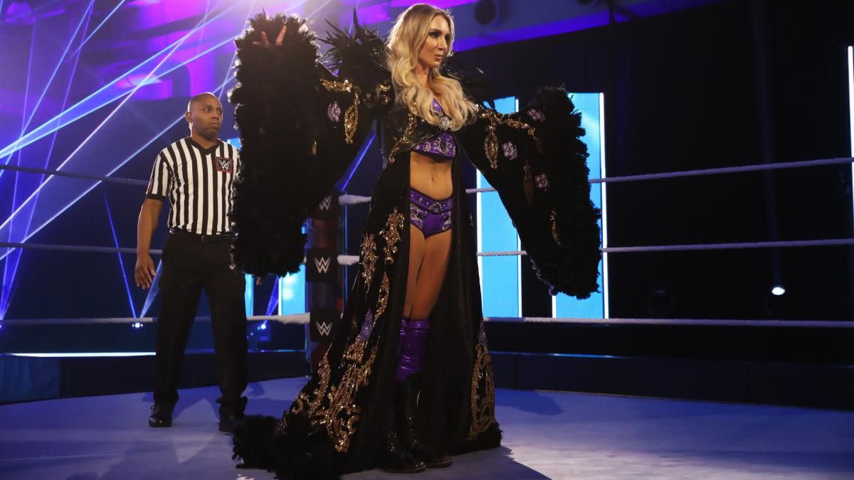 WWE wrestler Charlotte Flair wearin a robe in the ring