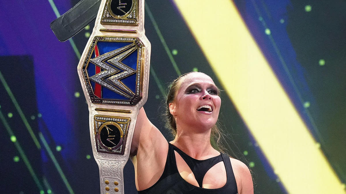 WWE wrestler Ronda Rousey holding the Smackdown Women's Championship