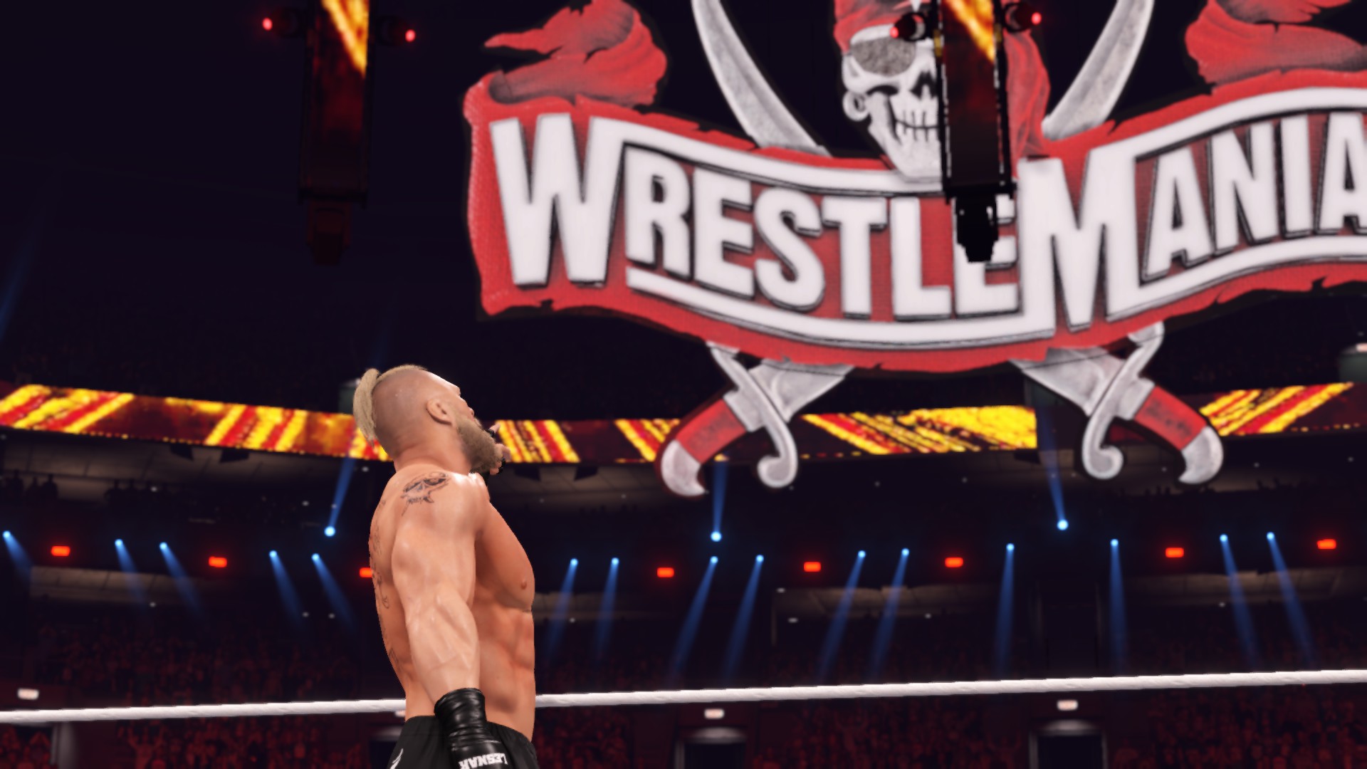 WWE 2K22 Brock pointing at the WrestleMania sign