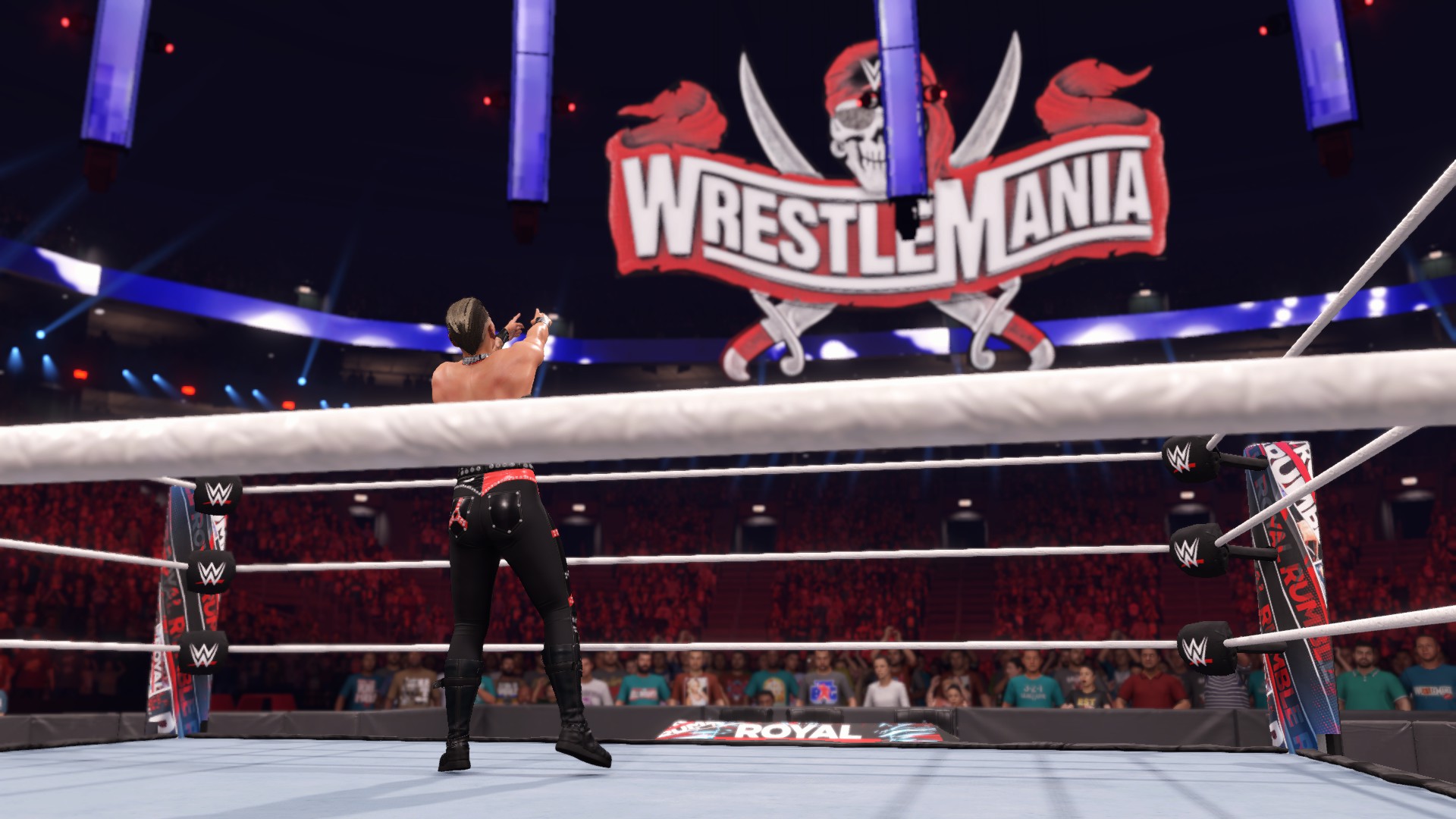 WWE 2K22 Rhea Ripley pointing at the WrestleMania sign