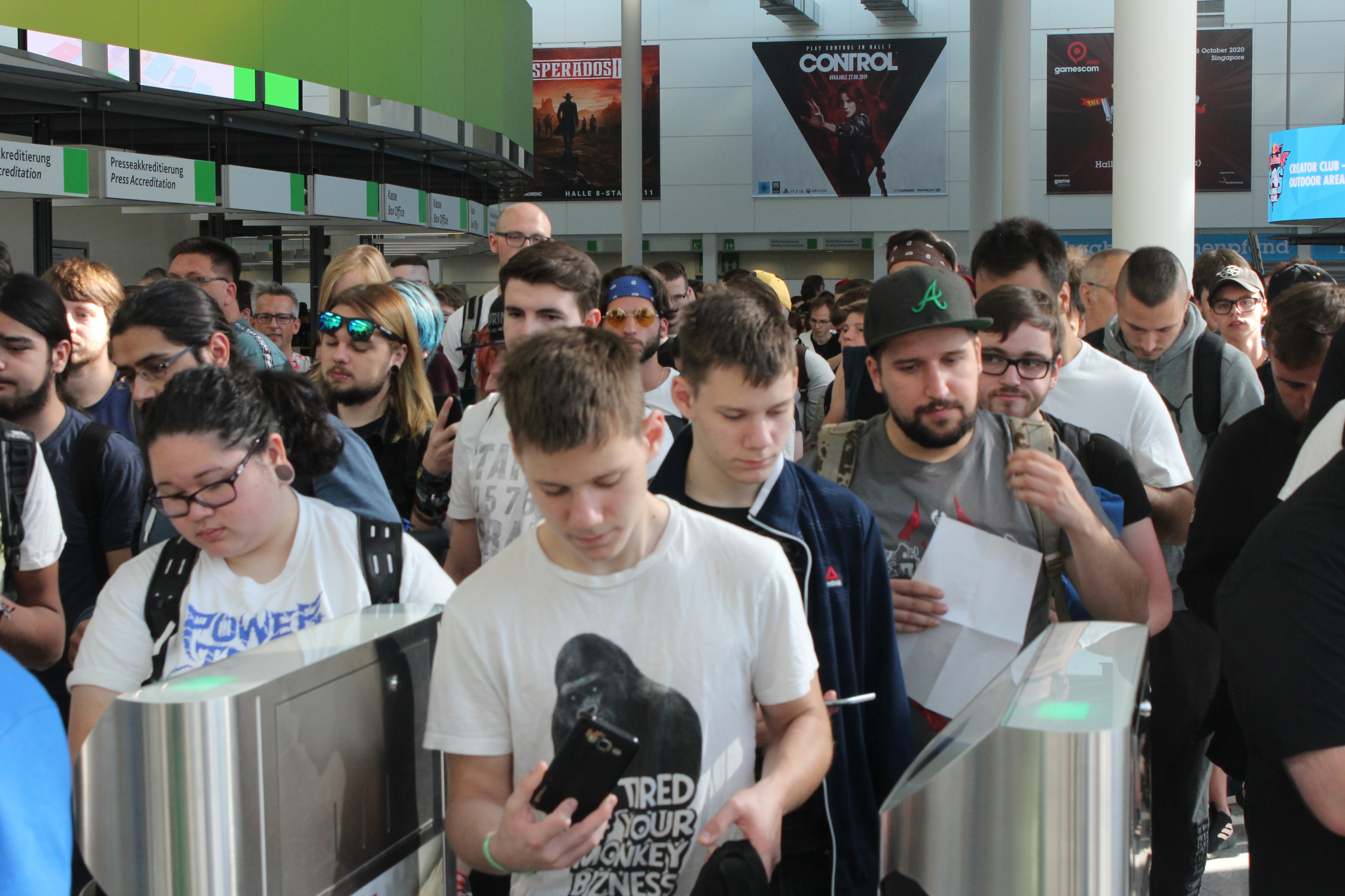 A crowd queuing to get into a games convention.