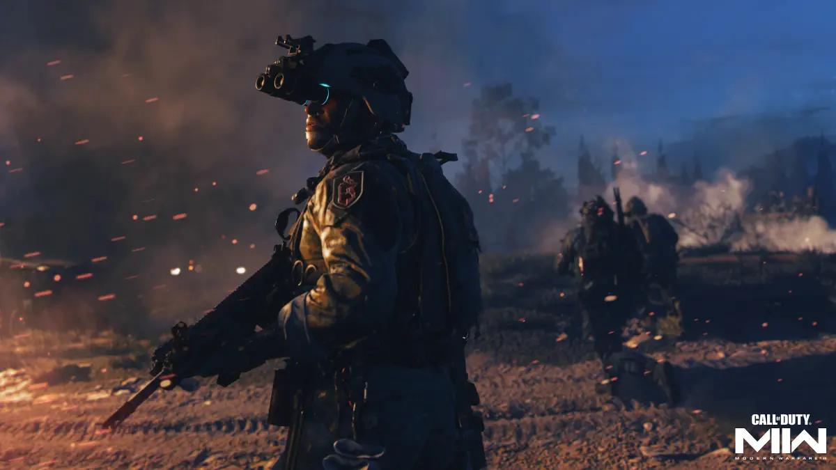 Call of Duty screenshot of a solider standing next to a burning vehicle.