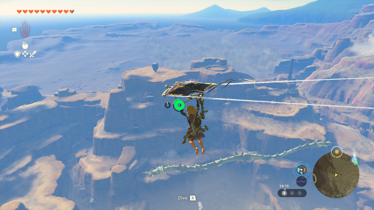 A screenshot from Tears of the Kingdom showing Link gliding through the sky using a paraglider. Beneath him is a large, long dragon also flying through the sky.