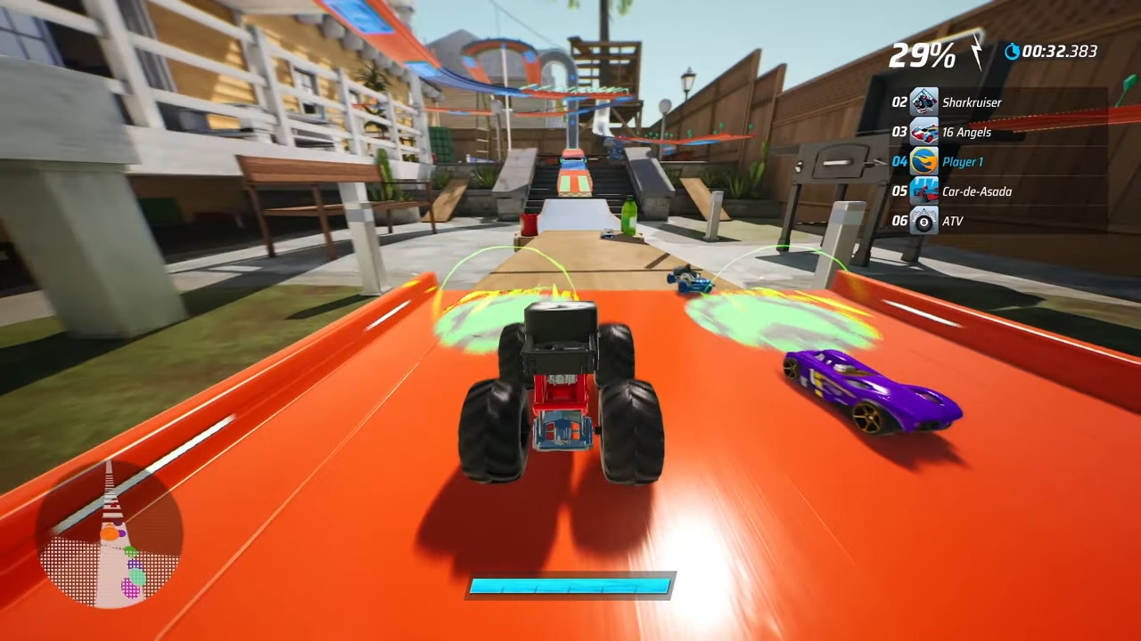 A Hotwheels Unleashed 2 screenshot showing a monster truck racing against a sports car