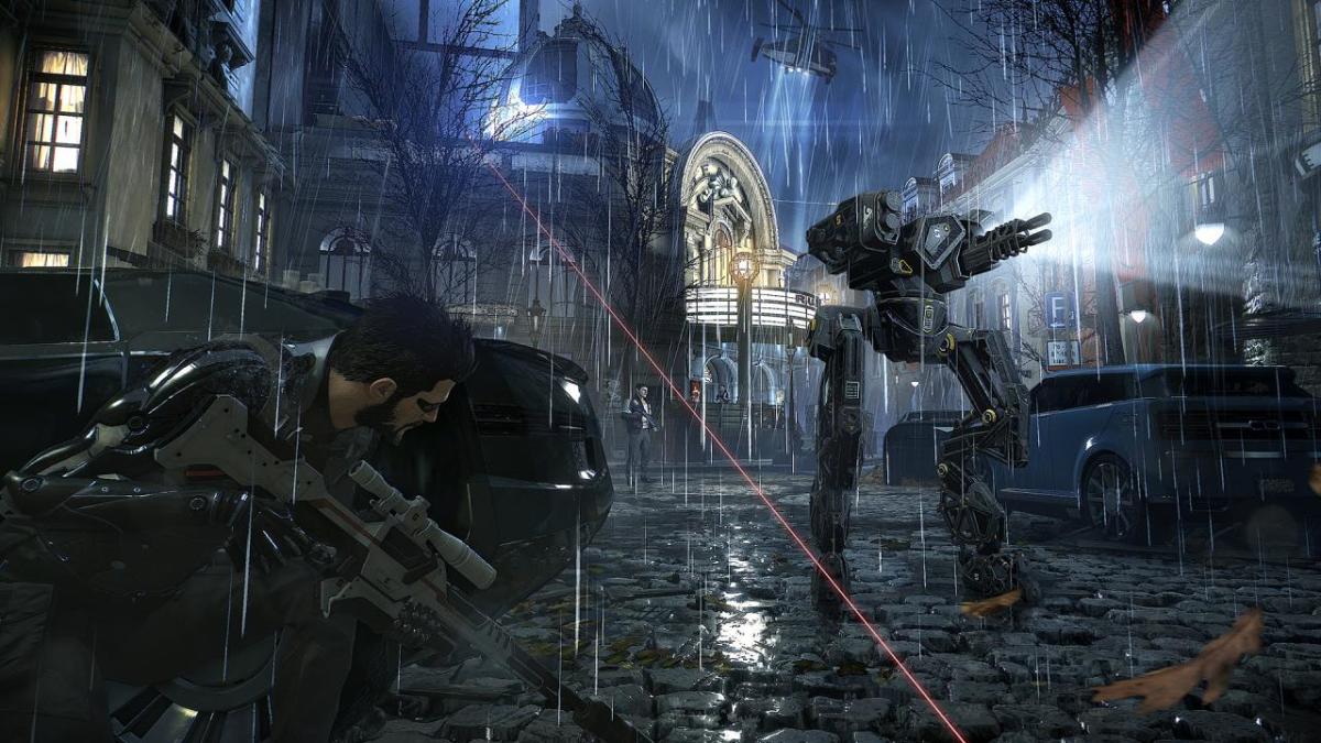 Adam Jensen takes cover as a robot searches the cobbled Prague streets in Deus Ex Mankind Divided.