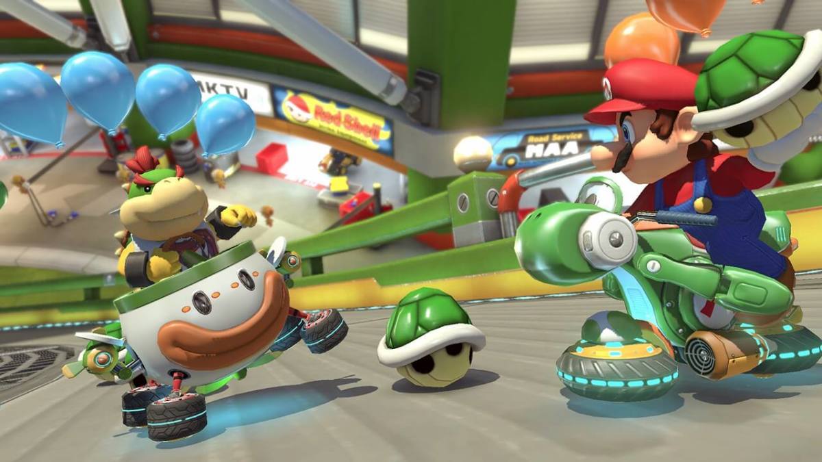 Mario throwing a shell at Bowser Jr.