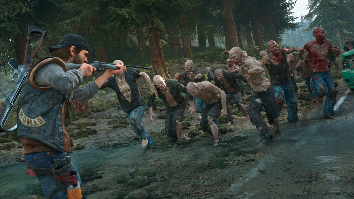 A biker aims a rifle at a horde of running zombies in Days Gone.