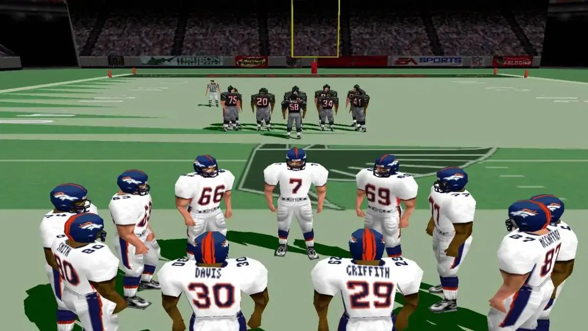 Players form a circle and prepare their play in Madden 99.