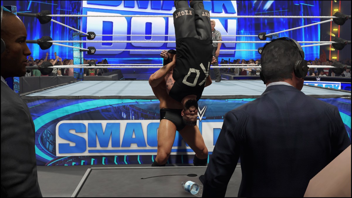 WWE 2K24 Gunther lifting Kevin Owens upsidedown