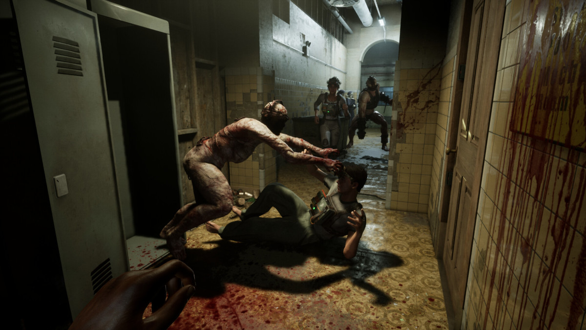 An Outlast Trials monster attacks one player character in a narrow hallway, as two more look on