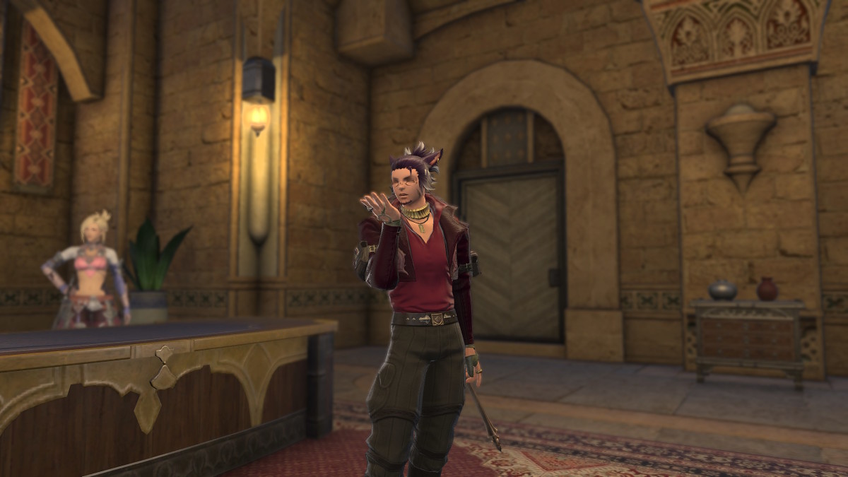A Final Fantasy 14 Miqo'te wearing a red jacket and black pants is making the "blow kiss" motions