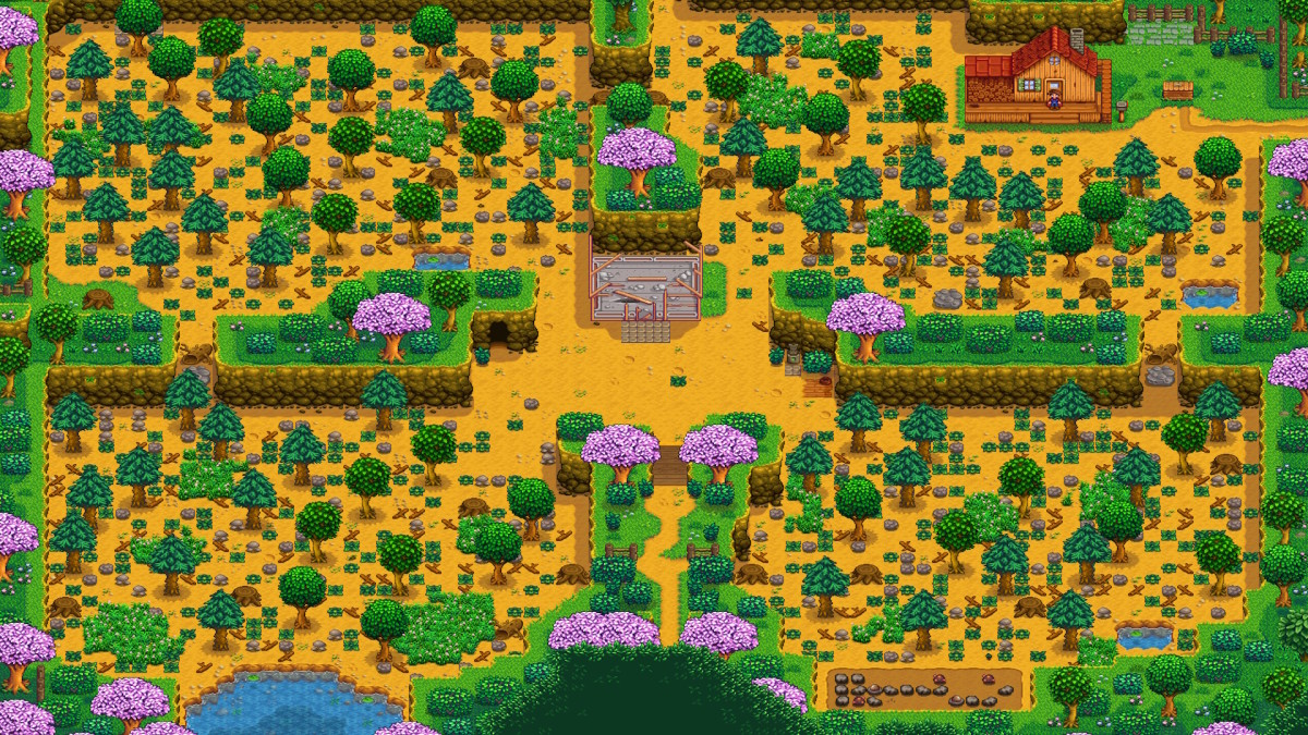 Stardew Valley's Four-Corners Farm in its starting form, with a forest zone, river zone, and hill-top zone