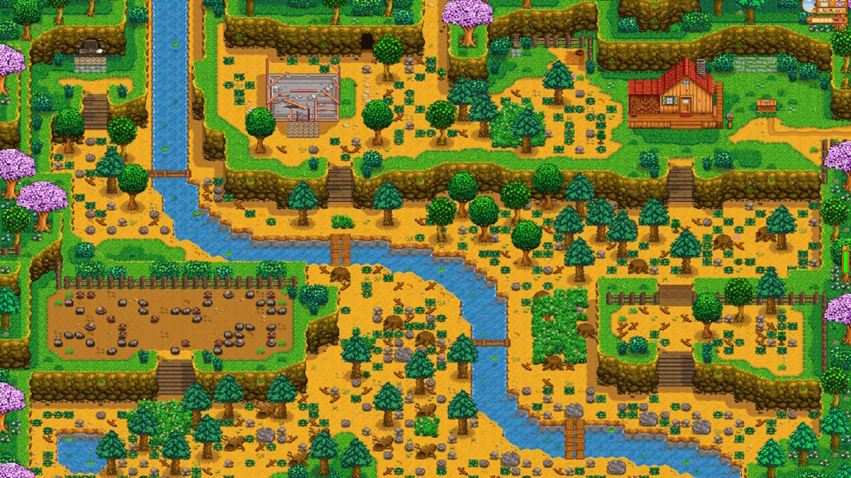 Stardew Valley's hill-top farm in its starting state, with a mining zone in the bottom left corner