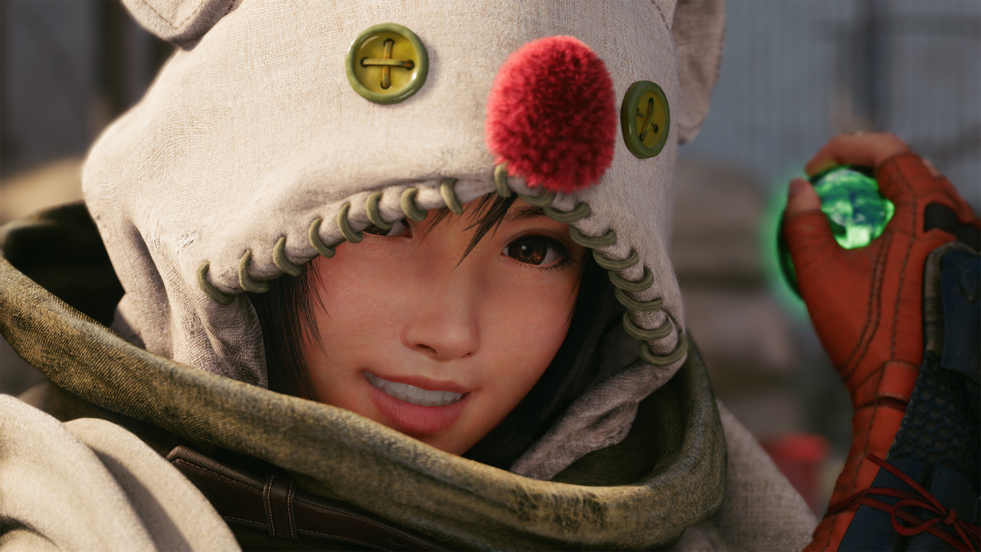 Final Fantasy 7 Remake's Yuffie Kitsuragi wearing a Moogle hood and holding a sphere of green materia