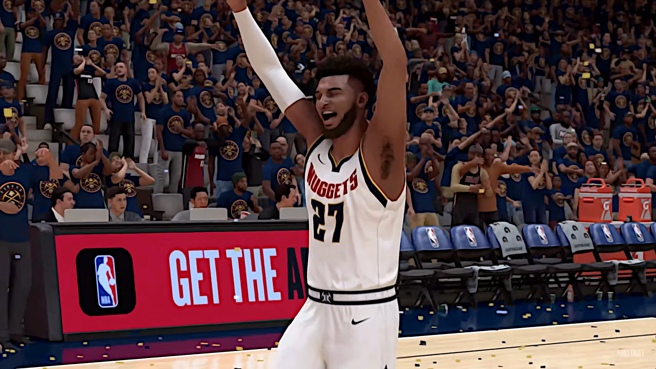A digital representation of Jamal Murray in his Nuggets 27 jersey is running down a basketball court with his arms raised in celebration