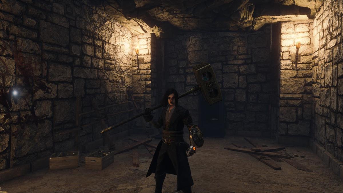 The player is standing in front of a safe in a dimly lit chamber.
