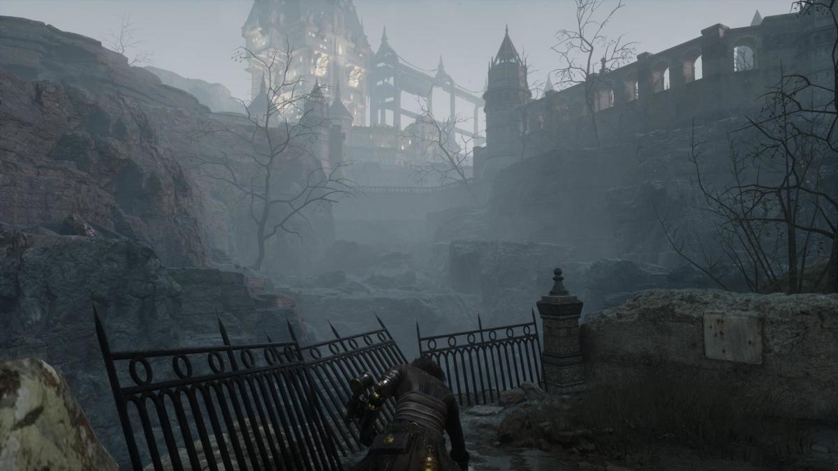 The player does the Check Ground emote in a cliffside area overlooking a large building in the distance.