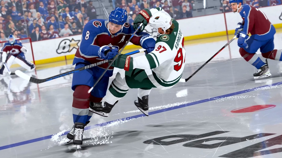 A hockey player in a blue jersey is pushing one in a green-and-white jersey onto the ice.
