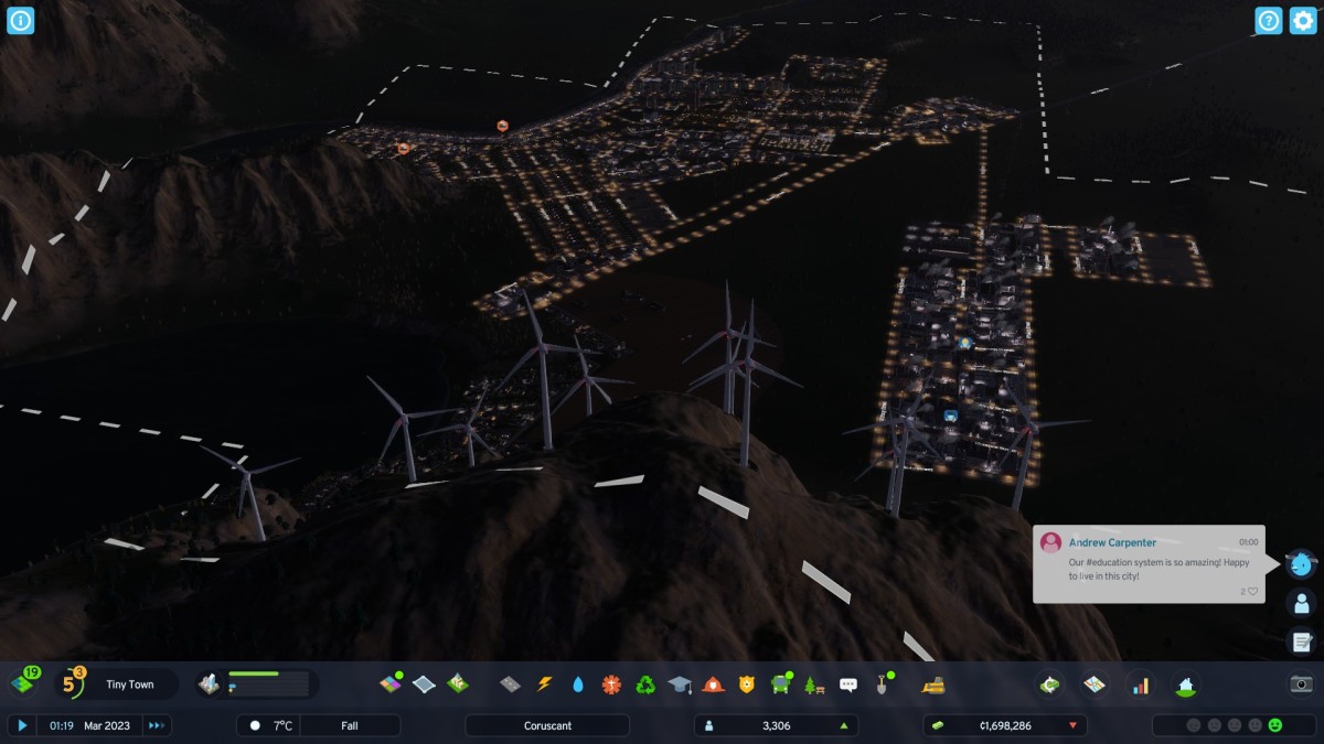 Cities: Skylines 2 screenshot of an illuminated city at night.