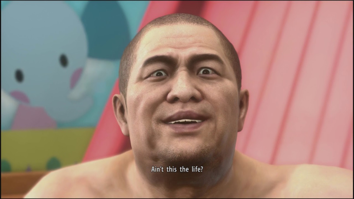 A large animated Japanese man wearing nothing but a diaper is sitting in a brightly colored nursery