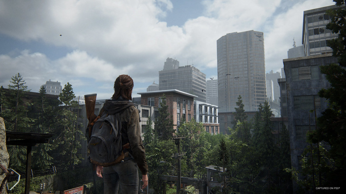 The Last of Us Part 2 Remastered character looking at a city.