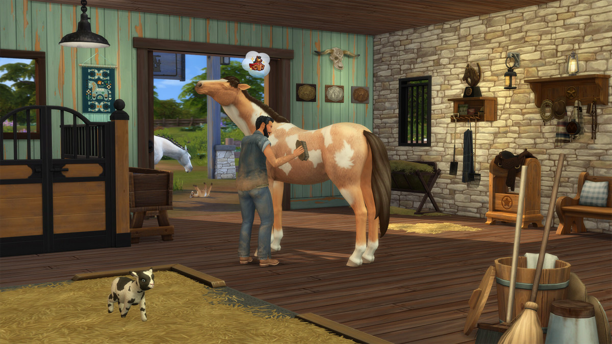 A Sim lovingly cares for a dappled horse in a spacious stone bard in the Sims 4 Horse Ranch expansion